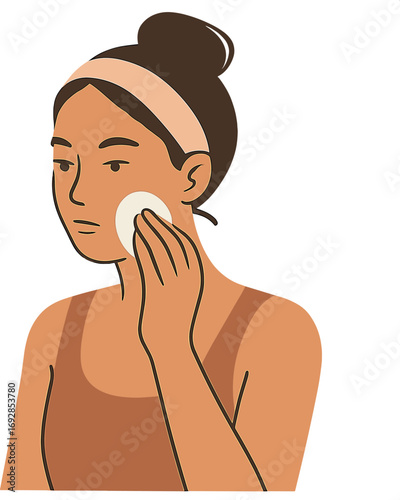Using a soft sponge, a young woman applies a beauty product to her face while concentrating on her reflection as part of her daily skincare or makeup routine