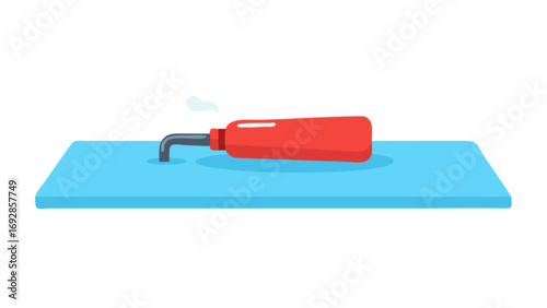 Red glue gun dispensing white adhesive on a blue surface