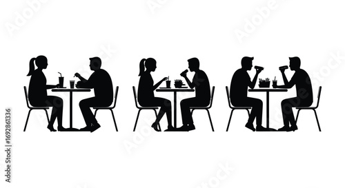 people dining together at tables silhouette