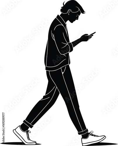 Man walking while looking at phone silhouette