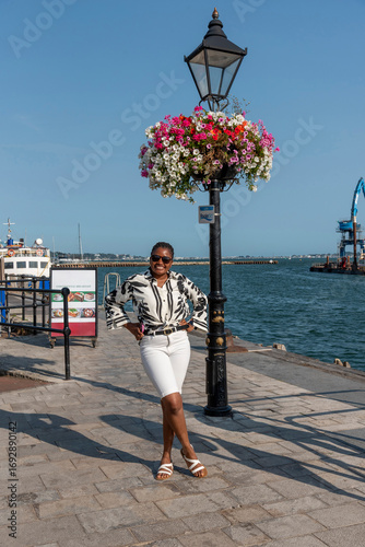 Poole Harbour Dorset England UK. 18.08.2025. Attractive tourist on the waterfront during a holiday in Dorset England UK.