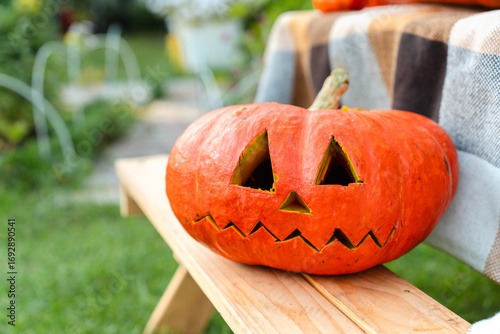 Jack-o-Lantern Pumpkins with Carved Eyes for Halloween in the Yard, real photo