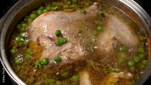 boiling of chicken with peas and potatoes