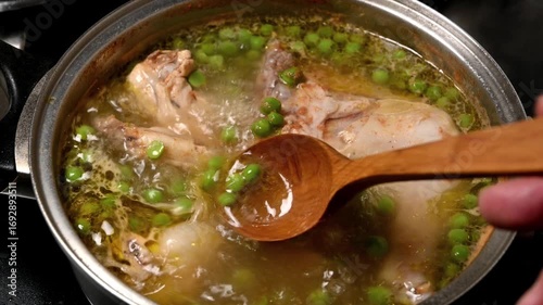 boiling of chicken with peas and potatoes