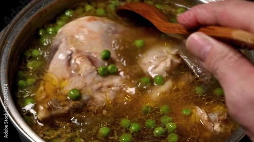 boiling of chicken with peas and potatoes