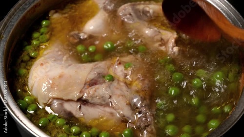 boiling of chicken with peas and potatoes