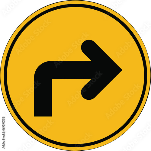 Bright yellow circular traffic sign indicating a sharp right turn ahead warning road symbol