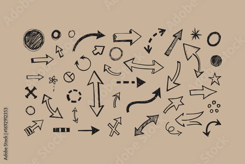 Collection of hand drawn arrows and decorative elements on kraft paper background