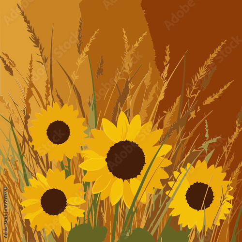 Yellow sunflowers and grasses in an autumnal setting. Vibrant flowers and tall grasses with warm tones and a natural backdrop.