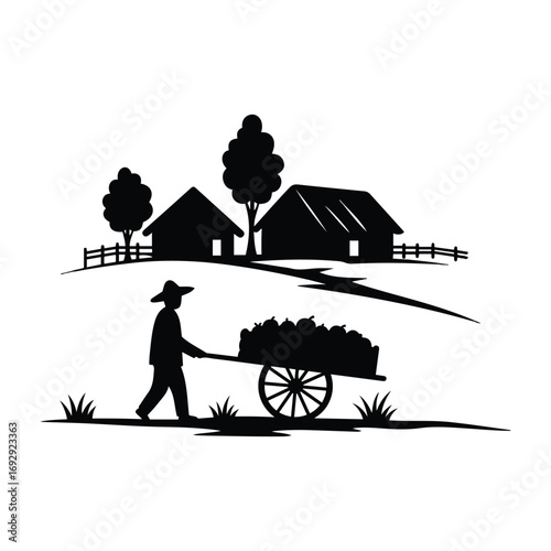 Silhouette of a farmer pushing a cart loaded with harvest in a rural landscape at sunset