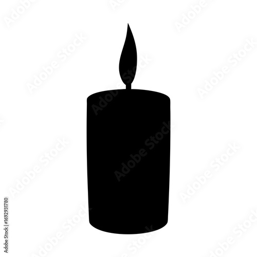 Silhouette of a lit candle radiating warmth in the darkness of night