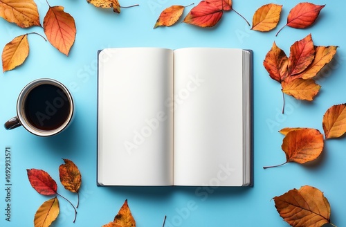 Cozy Autumn Afternoon With an Open Book and Warm Coffee on a Blue Table.