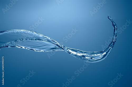 Flowing water stream splash isolated on transparent background, dynamic liquid curve motion