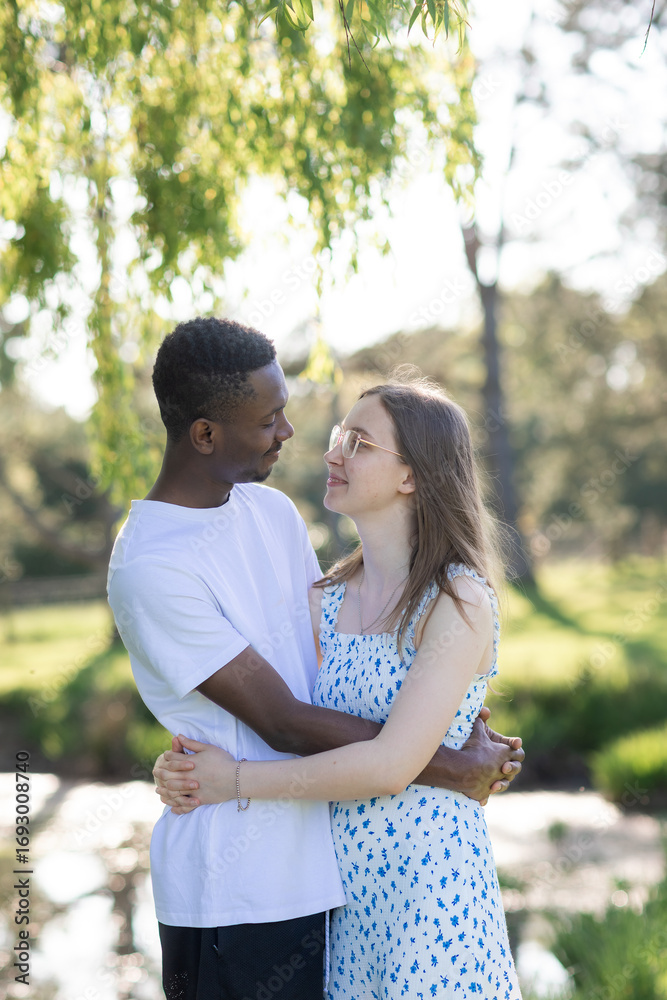 Fototapeta premium Romantic Interracial Couple Outdoors in Summer