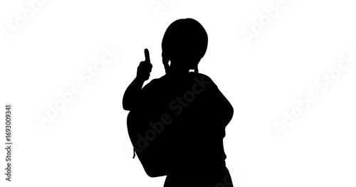 A silhouette of a child wearing a backpack and pointing a finger upward against a plain white background.
