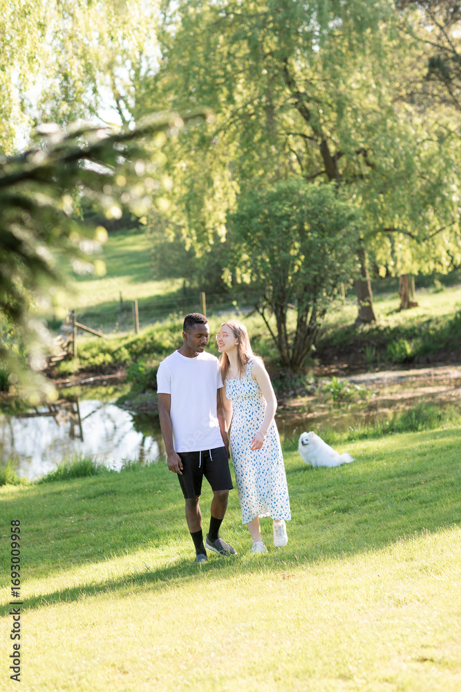 Fototapeta premium Romantic Interracial Couple Outdoors in Summer