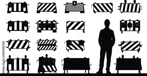 Construction worker standing with various traffic barricades, road safety barriers, warning signs, caution equipment, silhouette, work zone, safety gear, construction site, protection barriers