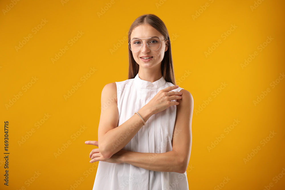 Obraz premium Portrait of beautiful woman on yellow background