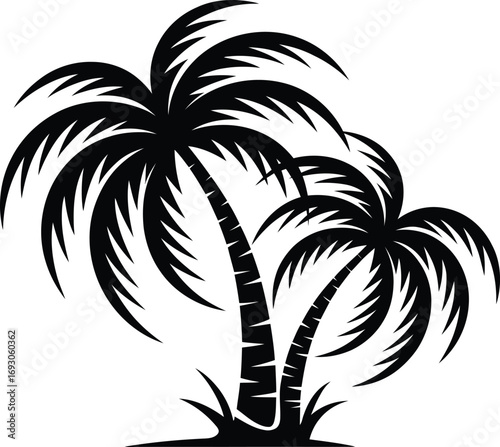 Two silhouetted palm trees on a tropical island beach
