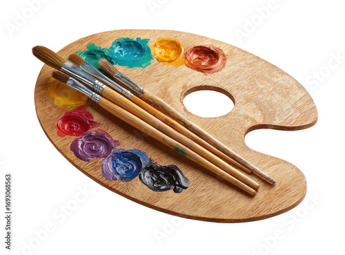 Wooden artist's palette with colorful paint and paintbrushes