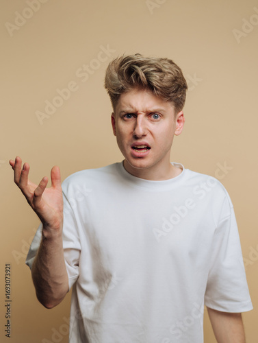 Принти на полотні Person showing confusion and frustration in a neutral setting during indoor acti