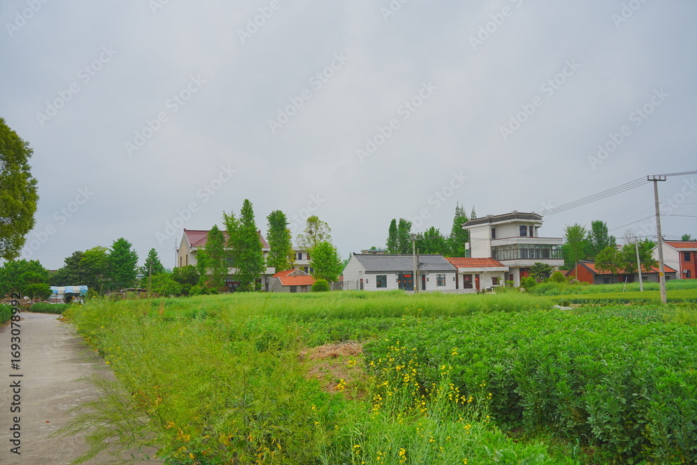 Obraz premium Nantong, Jiangsu, China: 04 21 2025: Beautiful Jiangsu Nantong traditional Chinese building, Roof, wall, tile and door