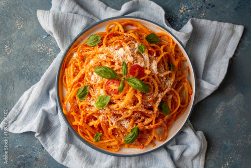Billede på lærred Flat spaghetti pasta with delicious tomato sauce and parmesan cheese