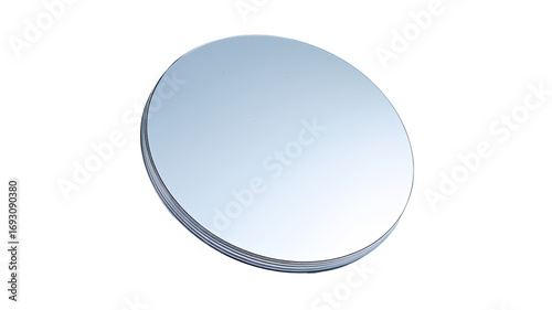 Circular, reflective, light gray disc.  A smooth, round,  optical element, possibly a lens or mirror.  Slightly elevated edge