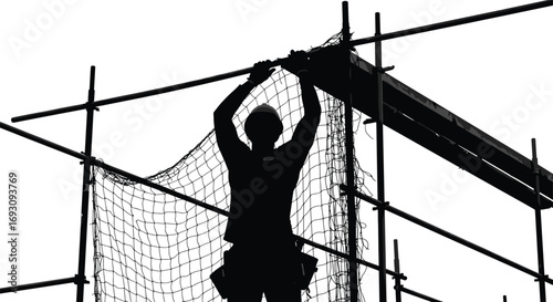 Silhouette of construction workers installing safety net on scaffolding, industrial building site, crane in background, urban construction safety, teamwork, height work.