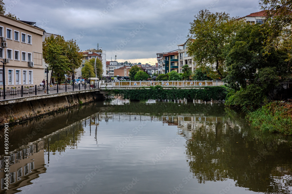 Fototapeta premium Canal with bridge and buildings in Yalova