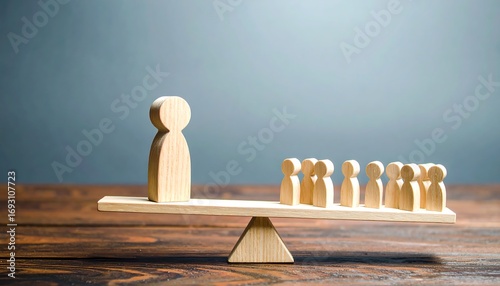 Wooden figures on a seesaw