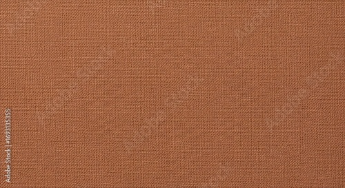 Detailed close-up of reddish-brown textured fabric, highlighting a rough textile pattern and weave for background use.