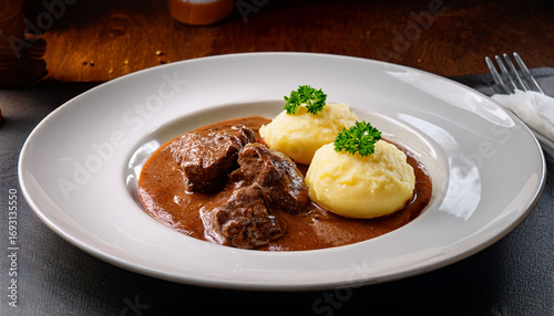 Beef Goulash Served With Fluffy Potato Dumplings And Horseradish In Cesky Krumlov Restaurant