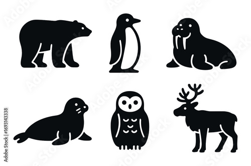 Arctic wildlife silhouette icon set. featuring bear, penguin, walrus, seal, owl, and reindeer.