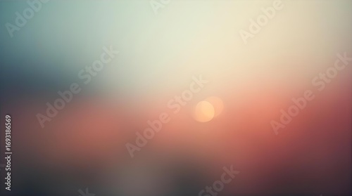 Soft focus blurred background with ethereal bokeh lights, a warm orange and peach sunset glow blending into cool blue and grey gradient colors, dreamy abstract art.