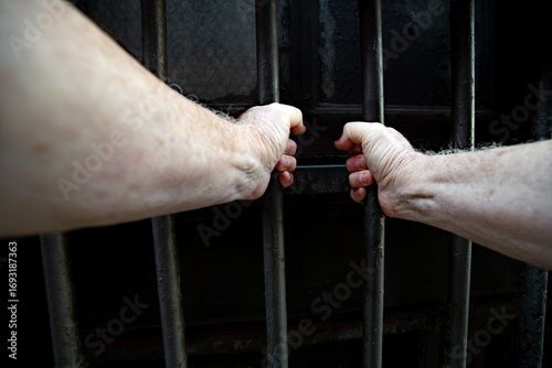 Prisoner behind bars