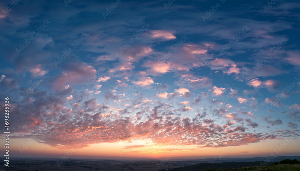 Obraz premium A Serene Sky With A Few Scattered Clouds Reflecting The Soft Colors Of Dawn The Clouds