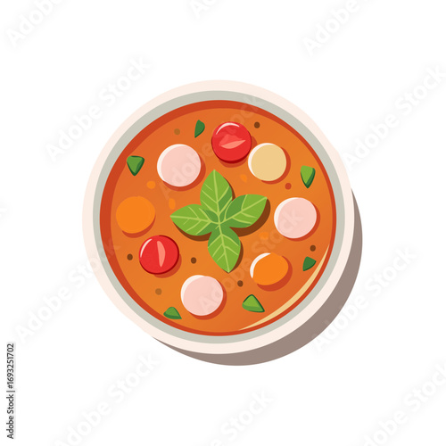 Top view of a rustic bowl filled with hearty vegetable soup and basil garnish