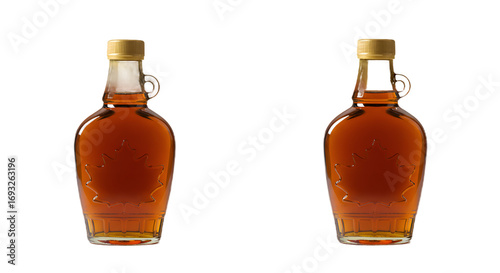 Two Amber Maple Syrup Bottles with Golden Caps and Embossed Maple Leaves