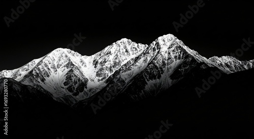 a black and white photo of a mountain range