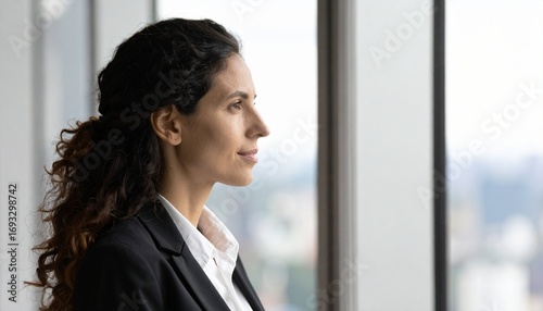 Confident Businesswoman Looking Out Office Window Free Download Confident Businesswoman Looking Out Office Window - GFXLoad