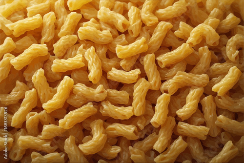 Close-up of cooked cavatappi pasta, a corkscrew-shaped macaroni, in a pile.