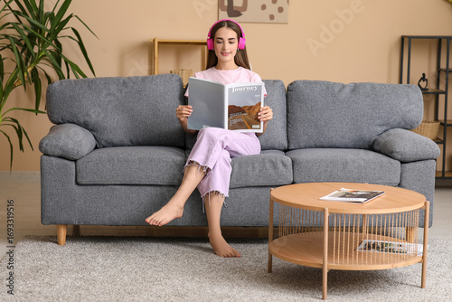 Young woman in headphones w...