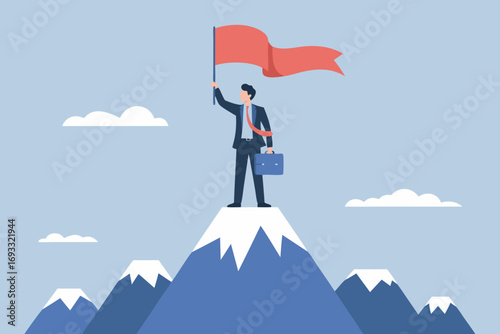 Success concept: Businessman on the peak of the mountain holding a winning flag
