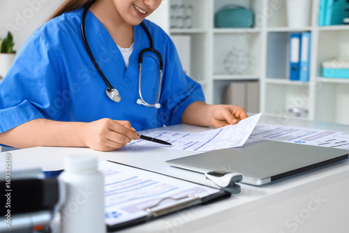 Female doctor working with ...