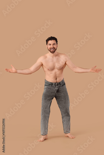 Happy bearded man on beige ...
