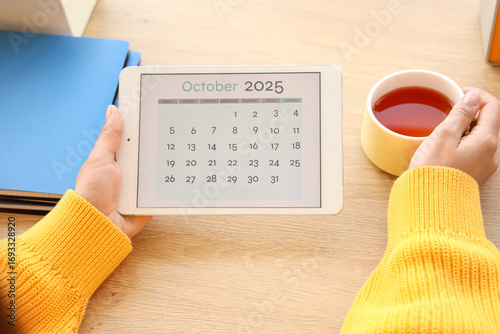 Female hands with calendar ...