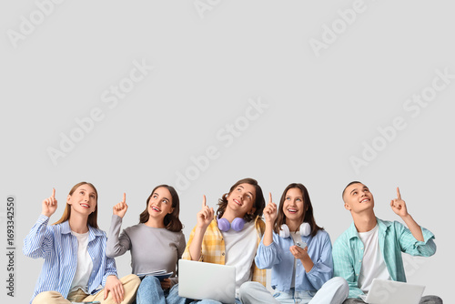 Group of students pointing ...