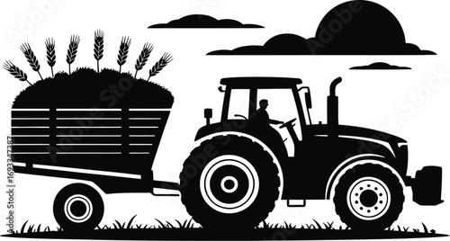 Farmer driving tractor with harvested grain trailer