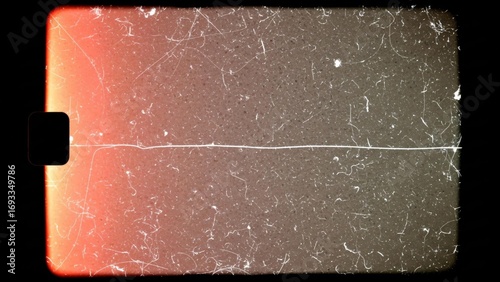 Vintage film grain texture with light leak and scratches